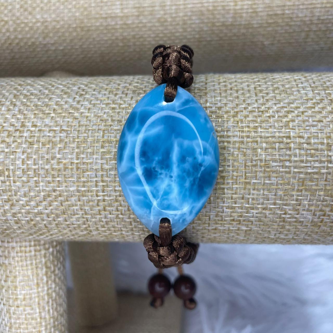 Man in blue bracelet